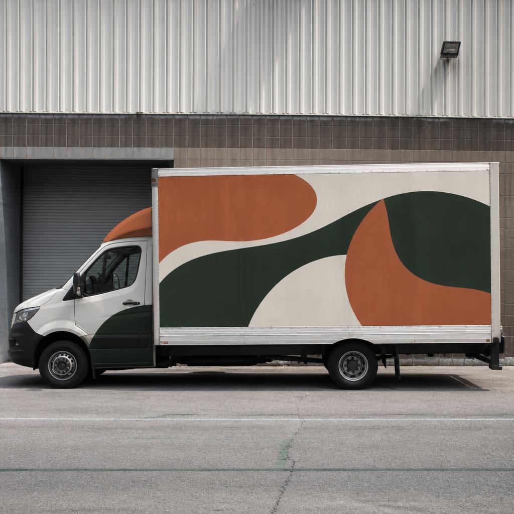 Box van with flowing terracotta and dark green graphic panels